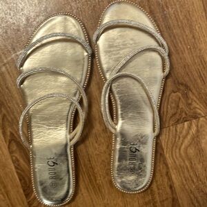 Size 11 gold flat sandals never worn